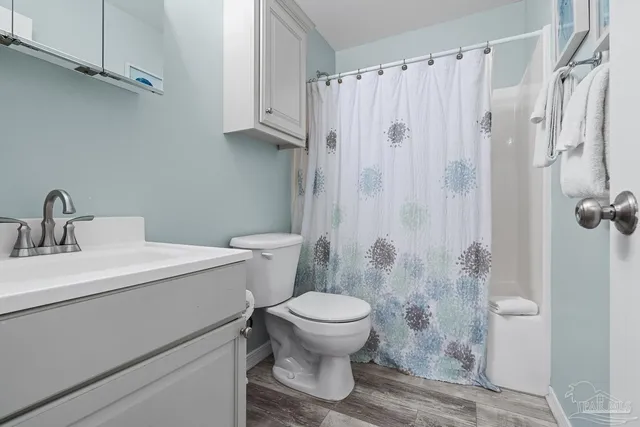 a view of entryway with wooden floor and stairs