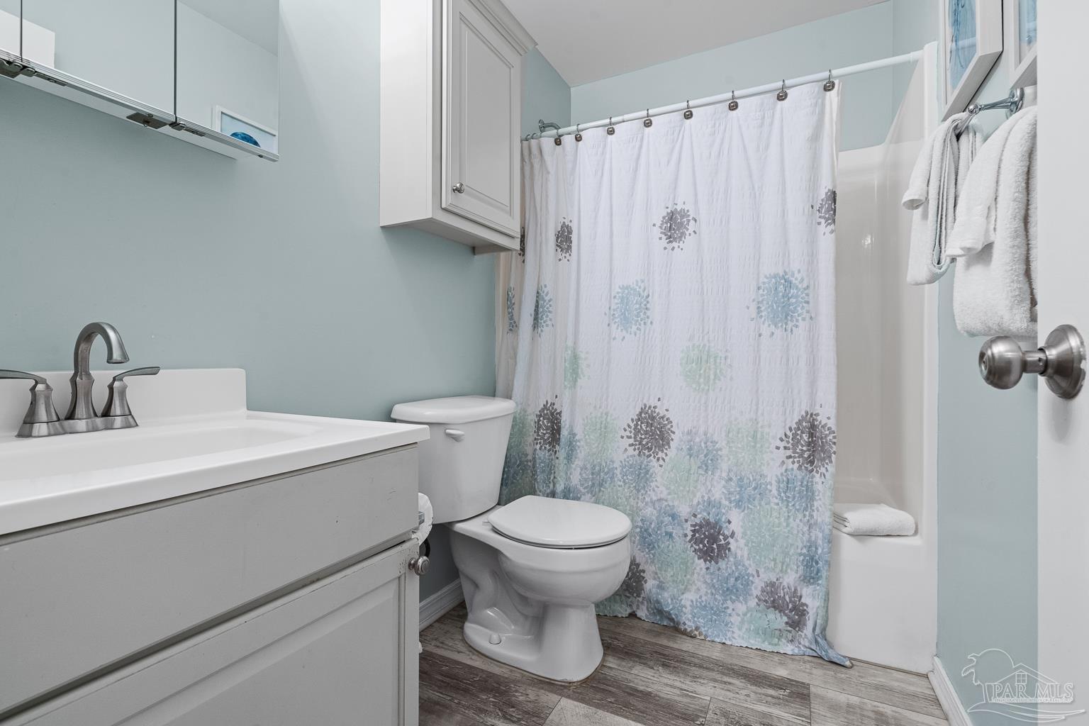 16470 Perdido Key Drive, Unit A 24 Perdido Key, FL 32507 - Photo 32 of 60 a white toilet sitting next to a bathroom sink