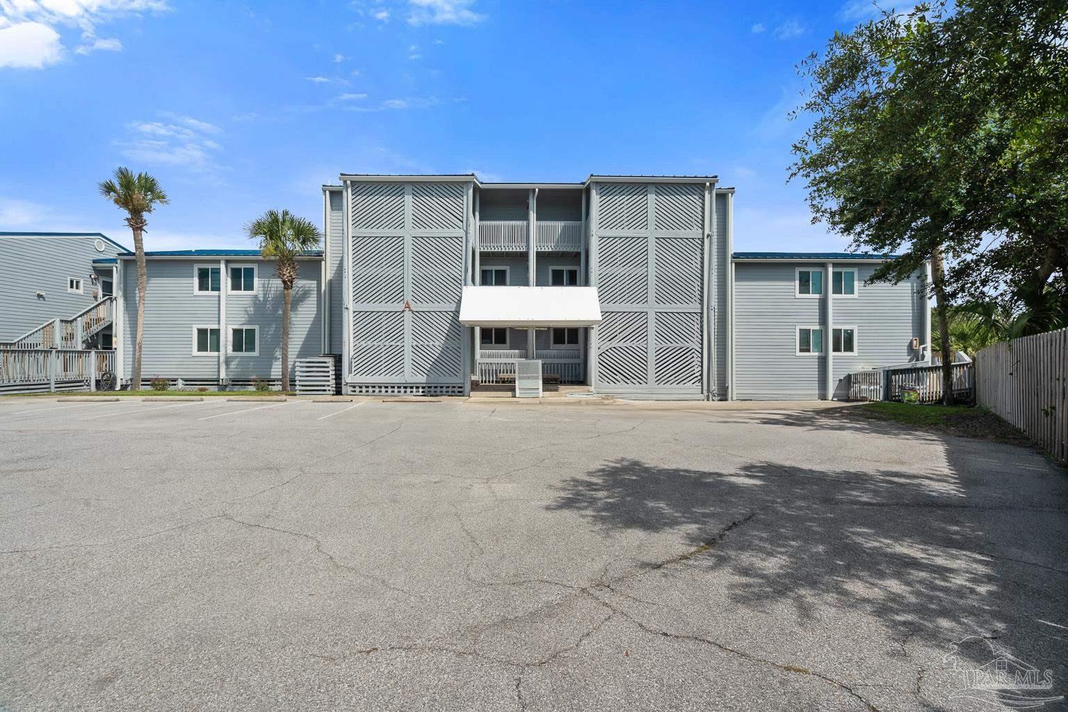 16470 Perdido Key Drive, Unit A 24 Perdido Key, FL 32507 - Photo 35 of 60 a front view of a house with a yard