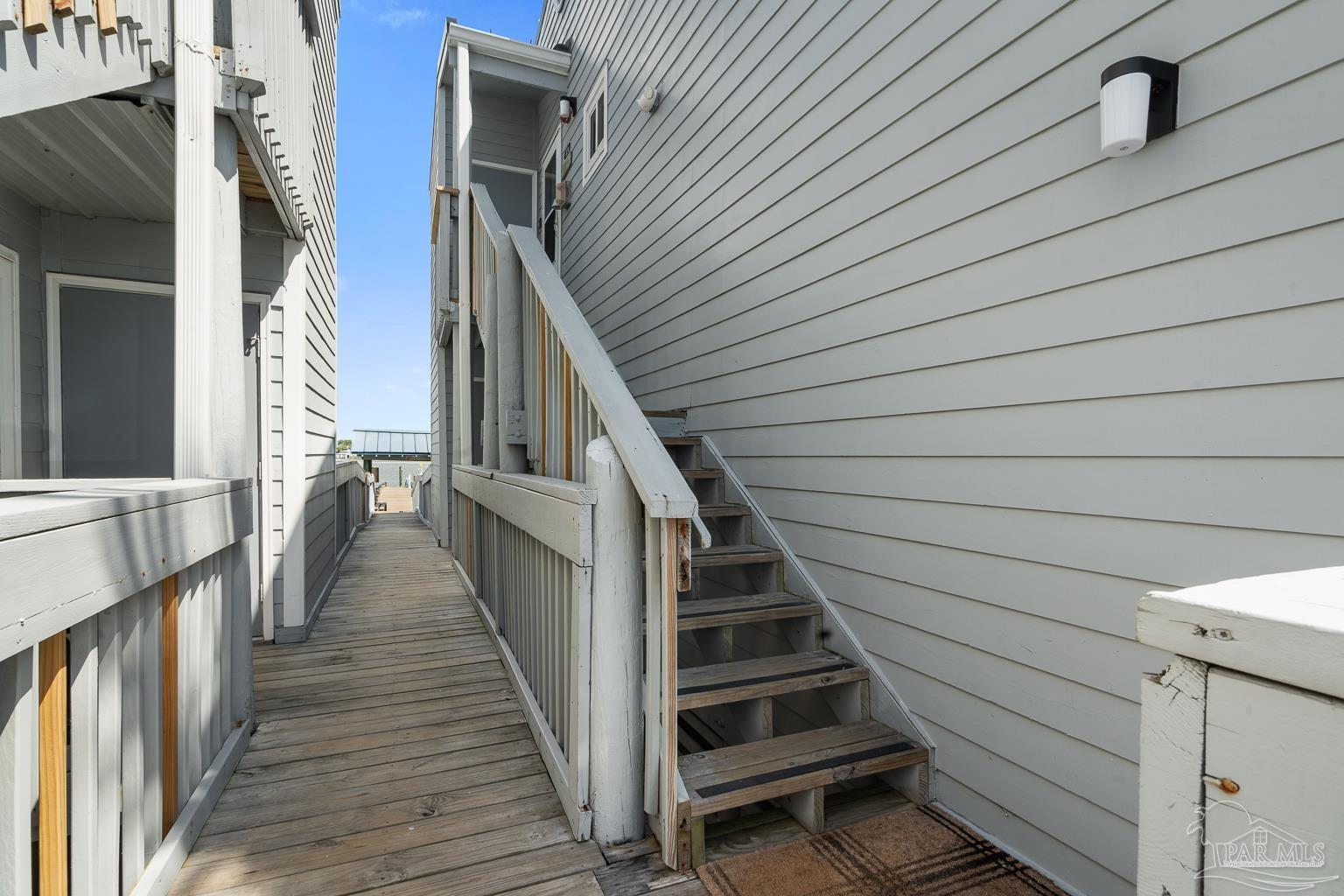 16470 Perdido Key Drive, Unit A 24 Perdido Key, FL 32507 - Photo 36 of 60 a view of entryway with wooden floor and stairs