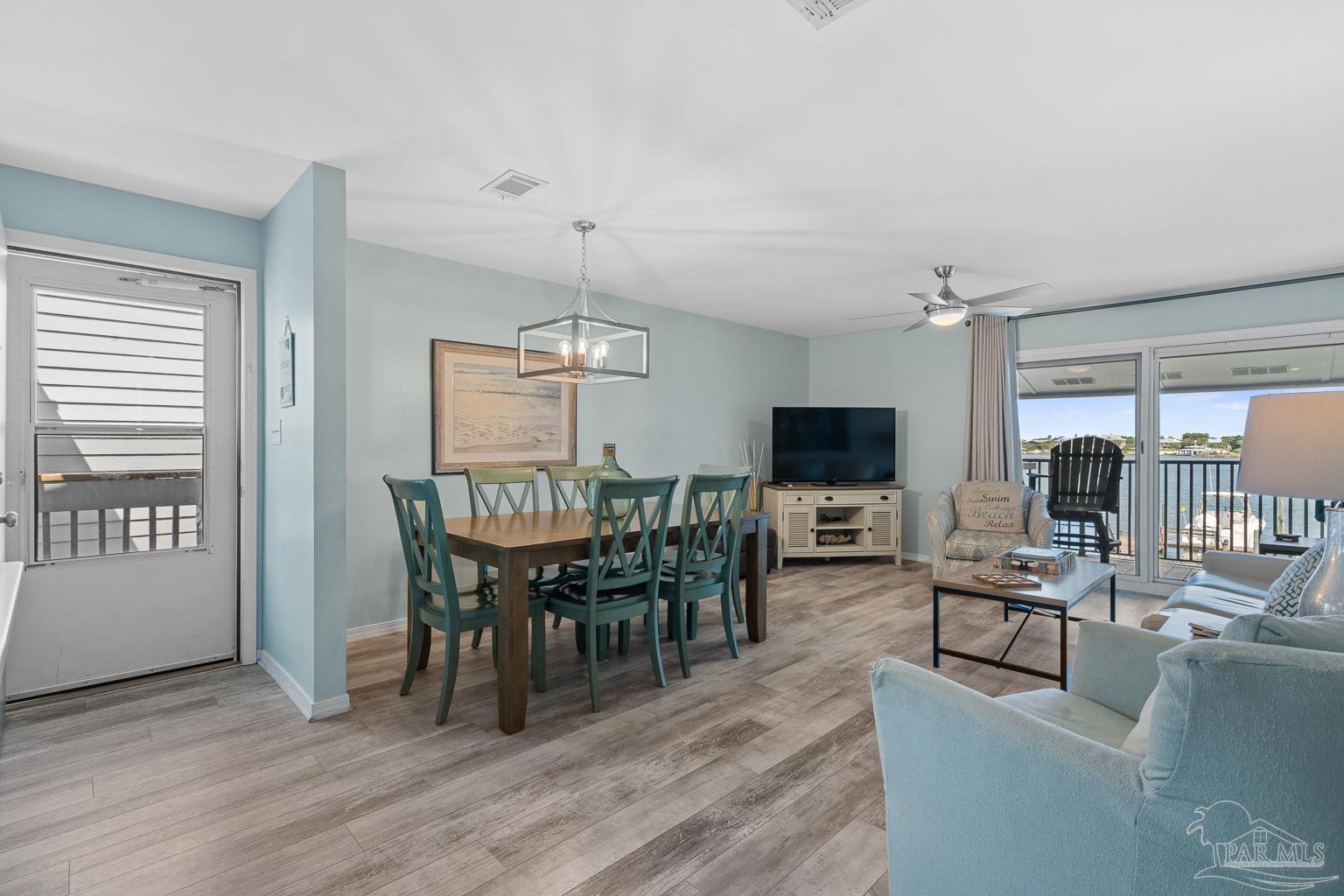 16470 Perdido Key Drive, Unit A 24 Perdido Key, FL 32507 - Photo 4 of 60 a view of a dining room with furniture window and wooden floor