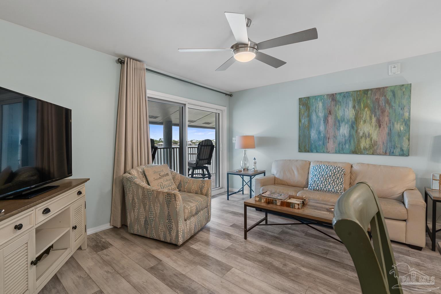 16470 Perdido Key Drive, Unit A 24 Perdido Key, FL 32507 - Photo 6 of 60 a living room with furniture and a flat screen tv