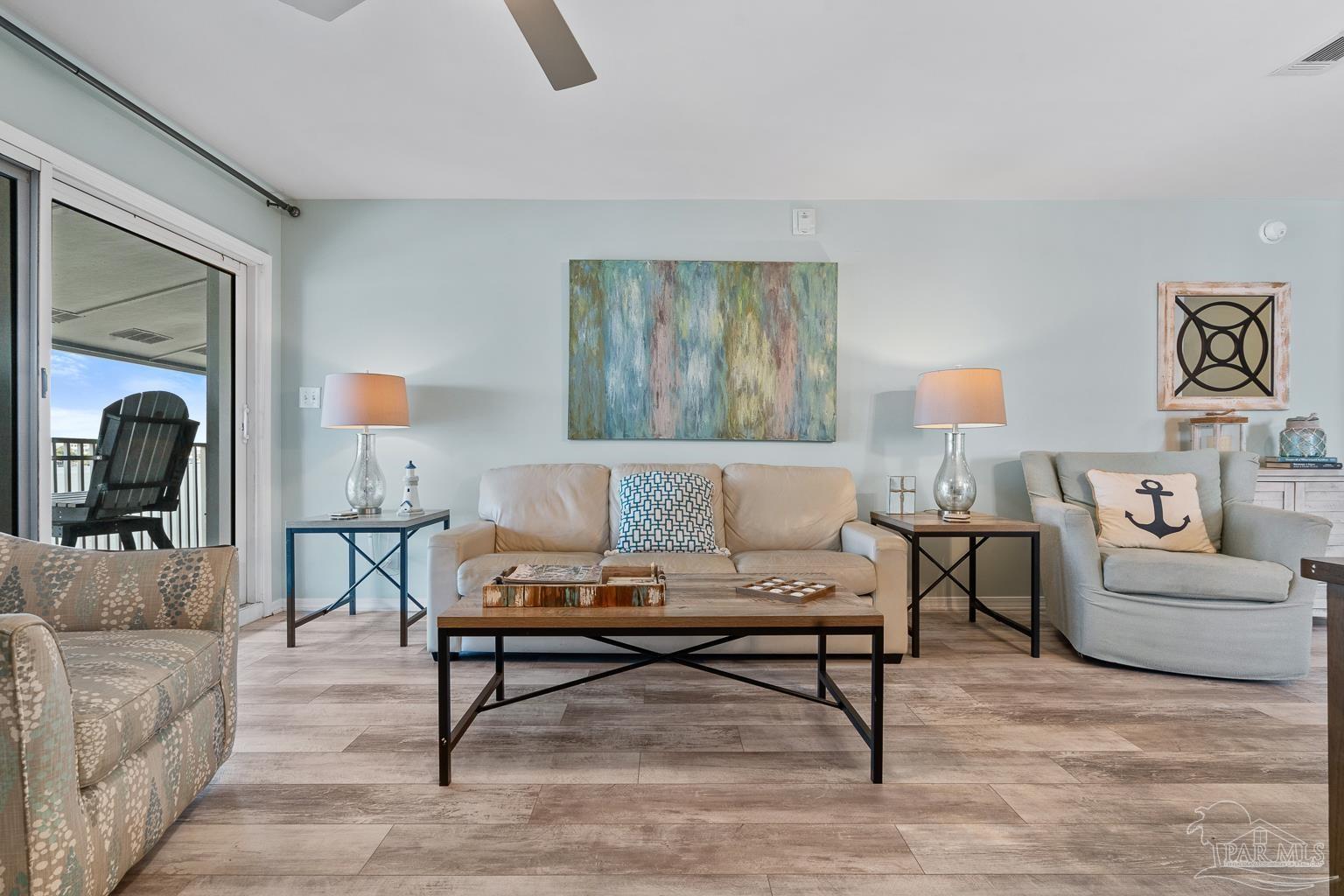 16470 Perdido Key Drive, Unit A 24 Perdido Key, FL 32507 - Photo 7 of 60 a living room with furniture and a couch