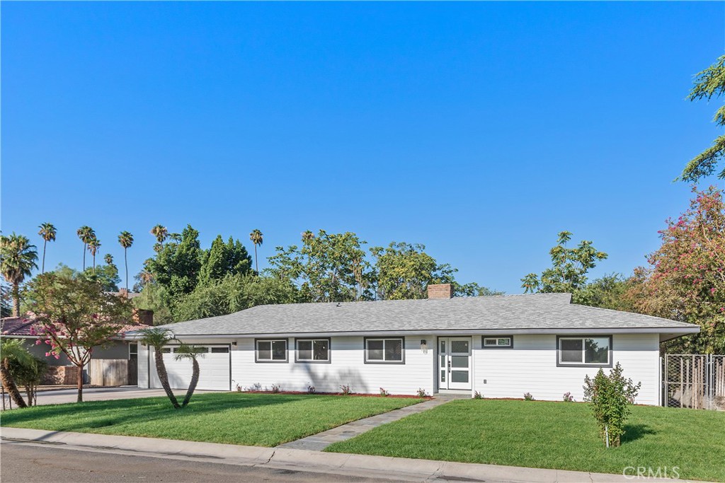 3241 Lakehill Place Riverside, CA 92501 - Photo 1 of 1 front view of a house with a yard