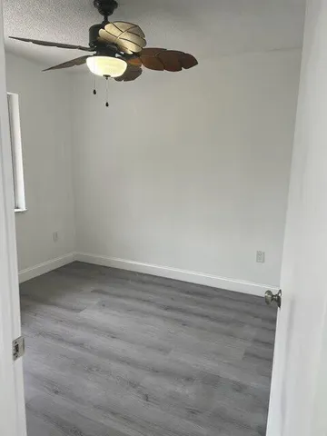 a bathroom with a bathtub shower sink vanity and toilet