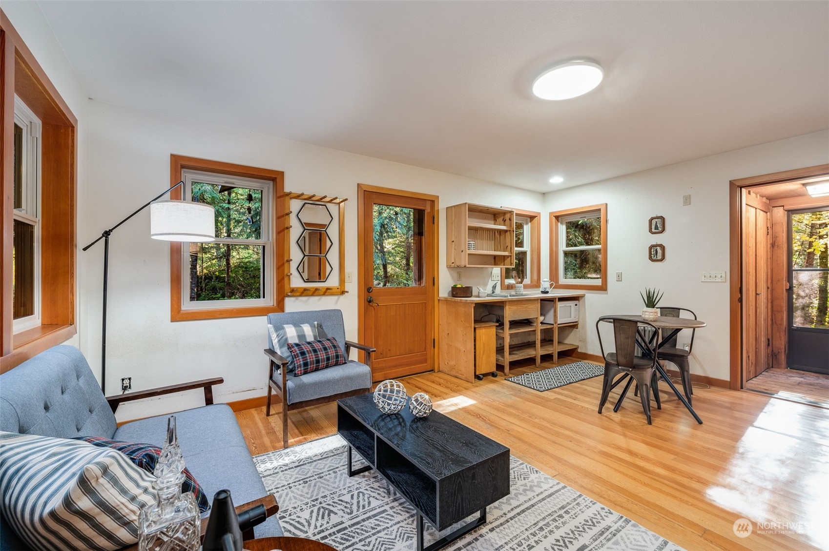 23406 Landers Road Southwest Vashon, WA 98070 - Photo 23 of 39 a living room with furniture and wooden floor