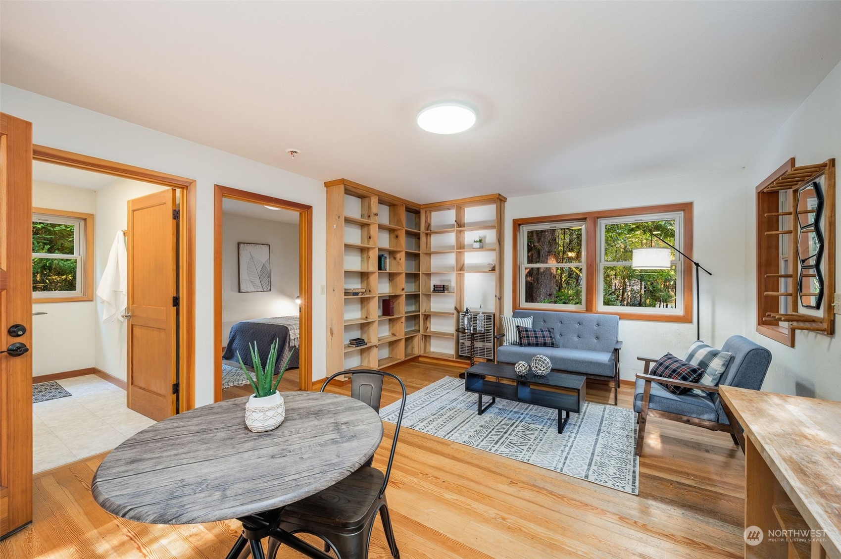 23406 Landers Road Southwest Vashon, WA 98070 - Photo 25 of 39 a living room with furniture two window and wooden floor