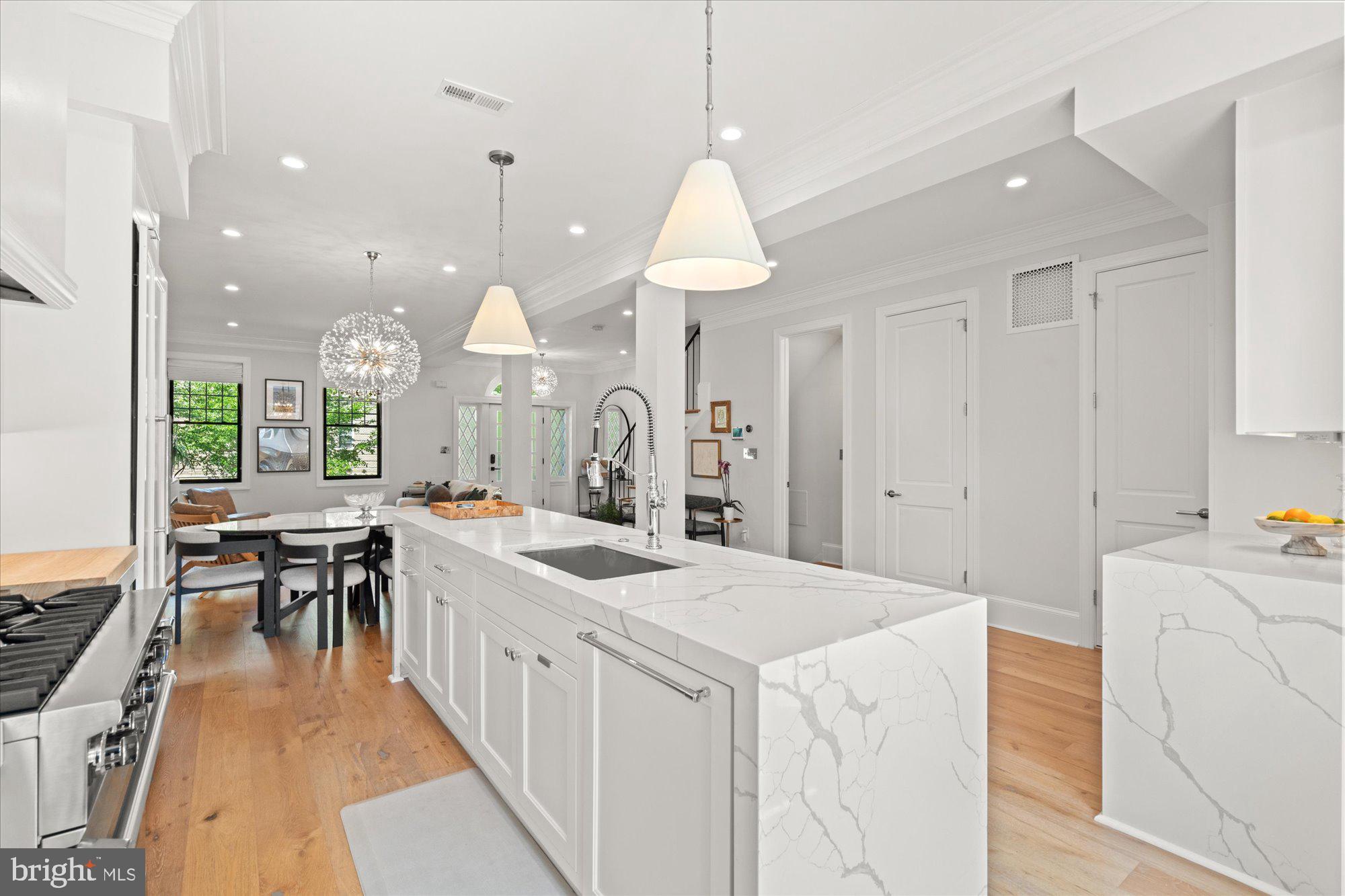 2610 Garfield Street Northwest Washington, DC 20008 - Photo 13 of 51 a large kitchen with lots of counter space and chandelier