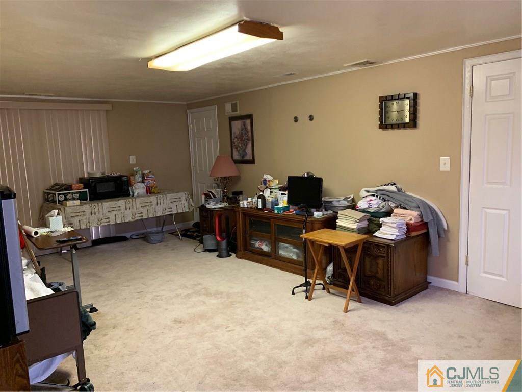 18 Hill Road Edison, NJ 08817 - Photo 11 of 13 a bedroom with furniture and a air conditioner vent