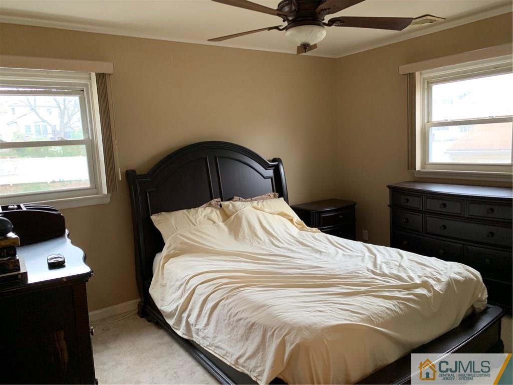 18 Hill Road Edison, NJ 08817 - Photo 3 of 13 a bed sitting in a bedroom next to a window