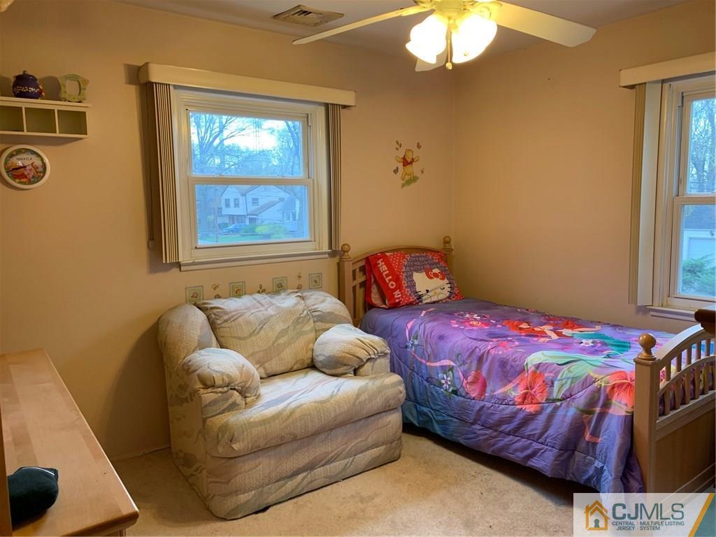 18 Hill Road Edison, NJ 08817 - Photo 4 of 13 a bedroom with a bed and window