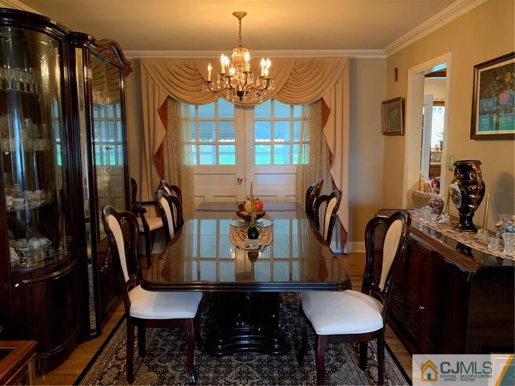 18 Hill Road Edison, NJ 08817 - Photo 8 of 13 a view of a dining room with furniture and chandelier