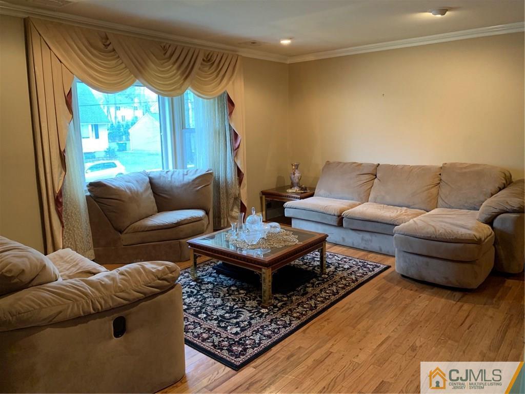 18 Hill Road Edison, NJ 08817 - Photo 10 of 13 a living room with furniture and a large window