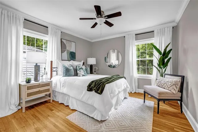 a bedroom with a large bed and a window