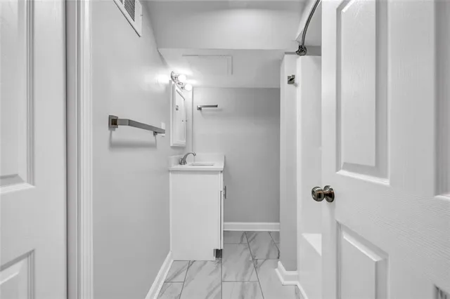 a bathroom with a sink and mirror