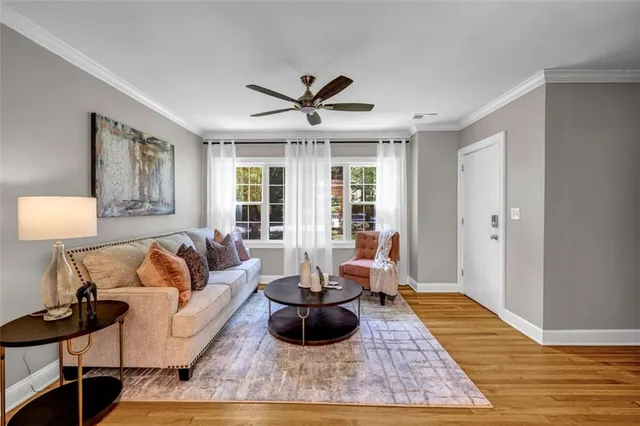 a living room with furniture and a rug