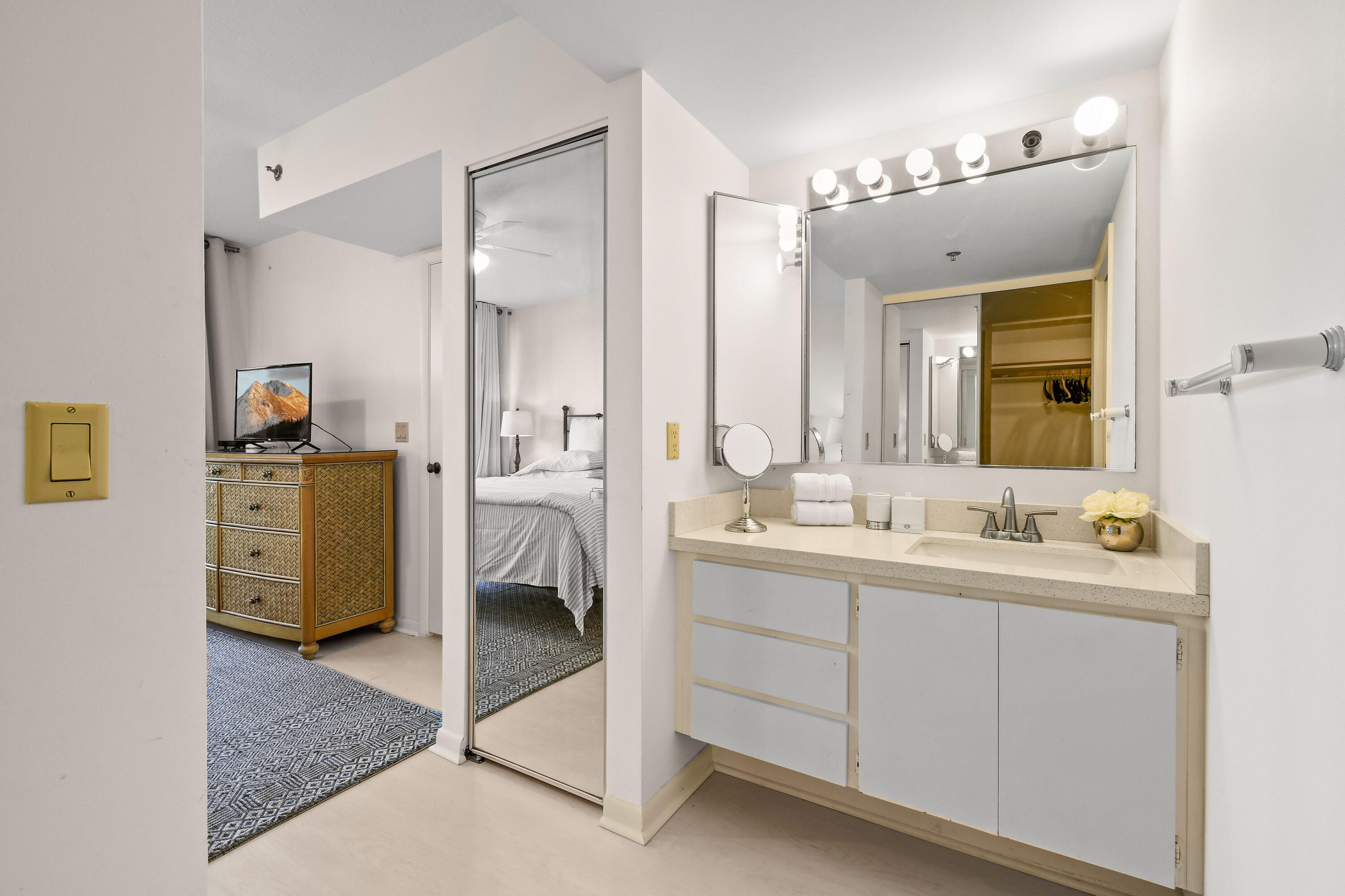 Undisclosed Address Jupiter, FL 33477 - Photo 12 of 23 a bathroom with a double vanity sink mirror and toilet