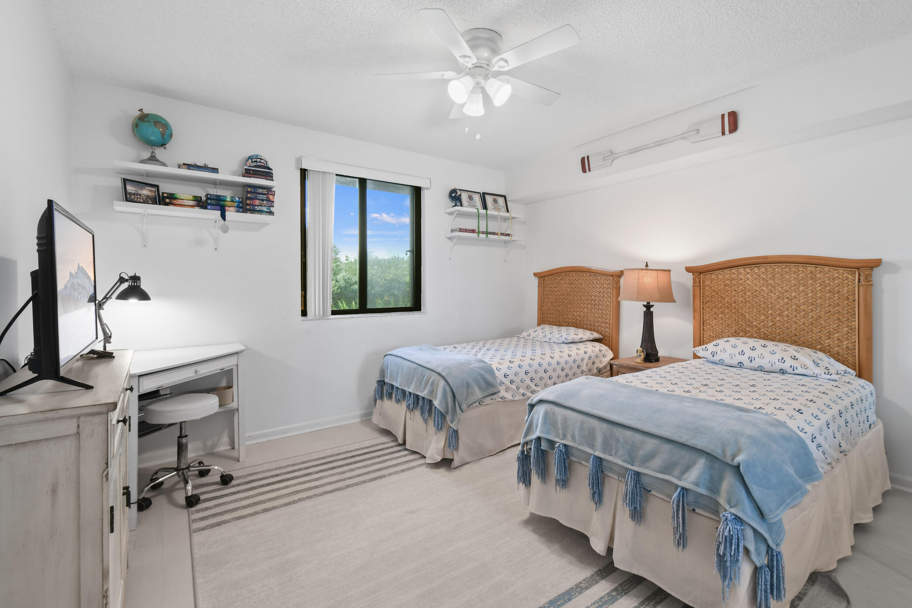 Undisclosed Address Jupiter, FL 33477 - Photo 13 of 23 a bedroom with two beds and painting on the wall