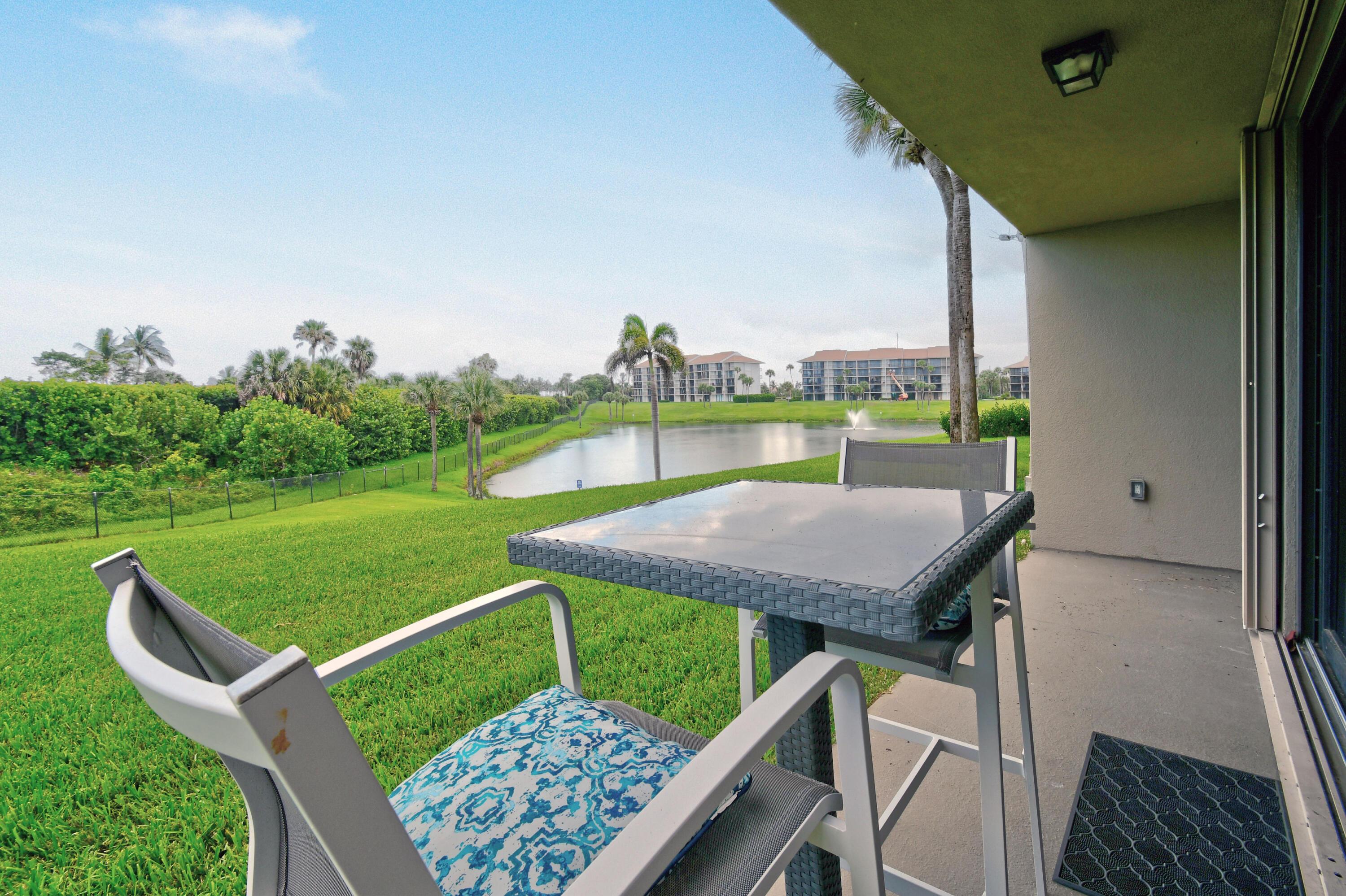 Undisclosed Address Jupiter, FL 33477 - Photo 16 of 23 a view of a chairs and table on the deck