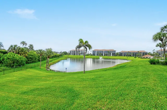 a view of a lake with a yard