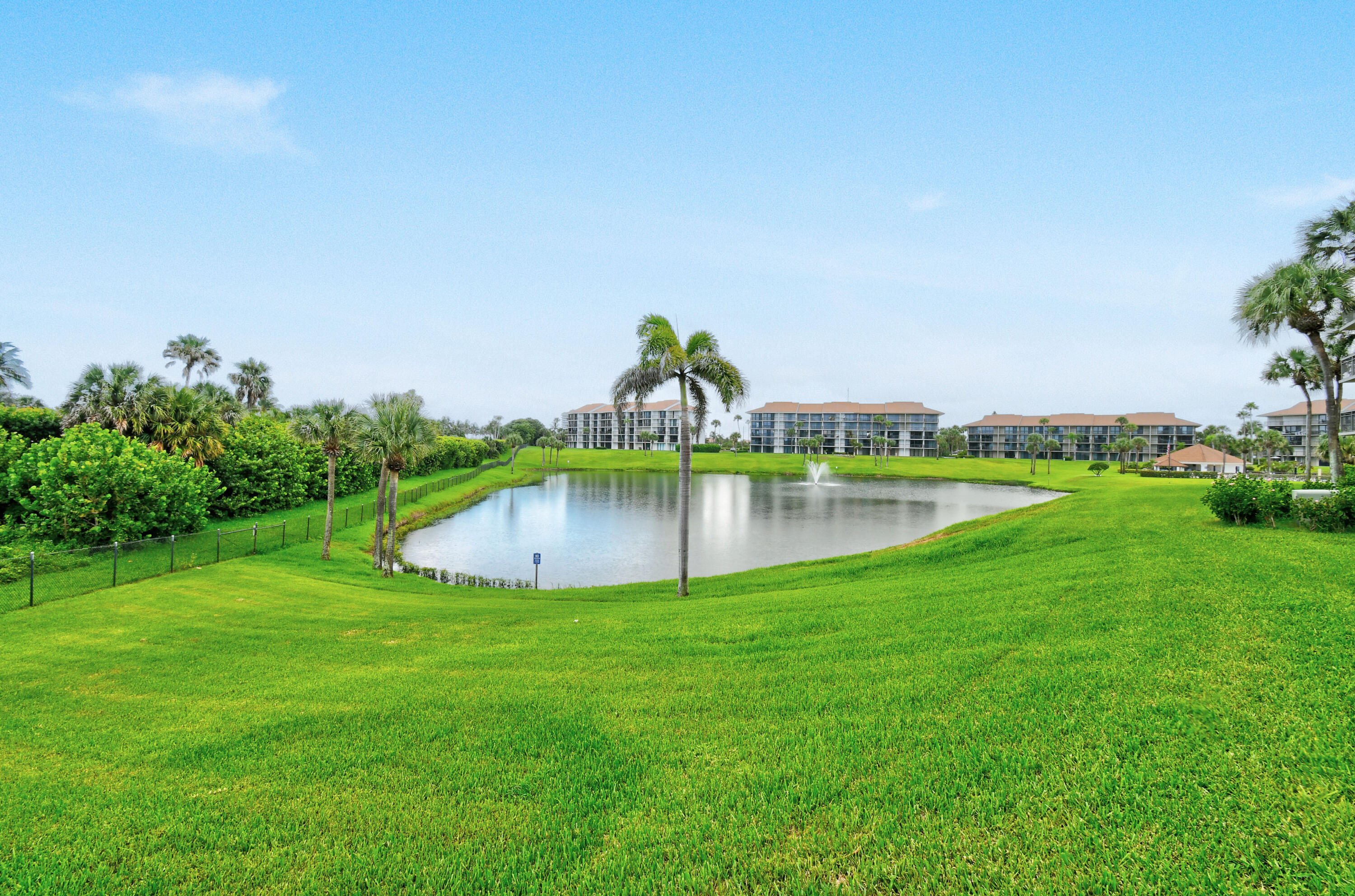 Undisclosed Address Jupiter, FL 33477 - Photo 17 of 23 a view of a lake with a yard