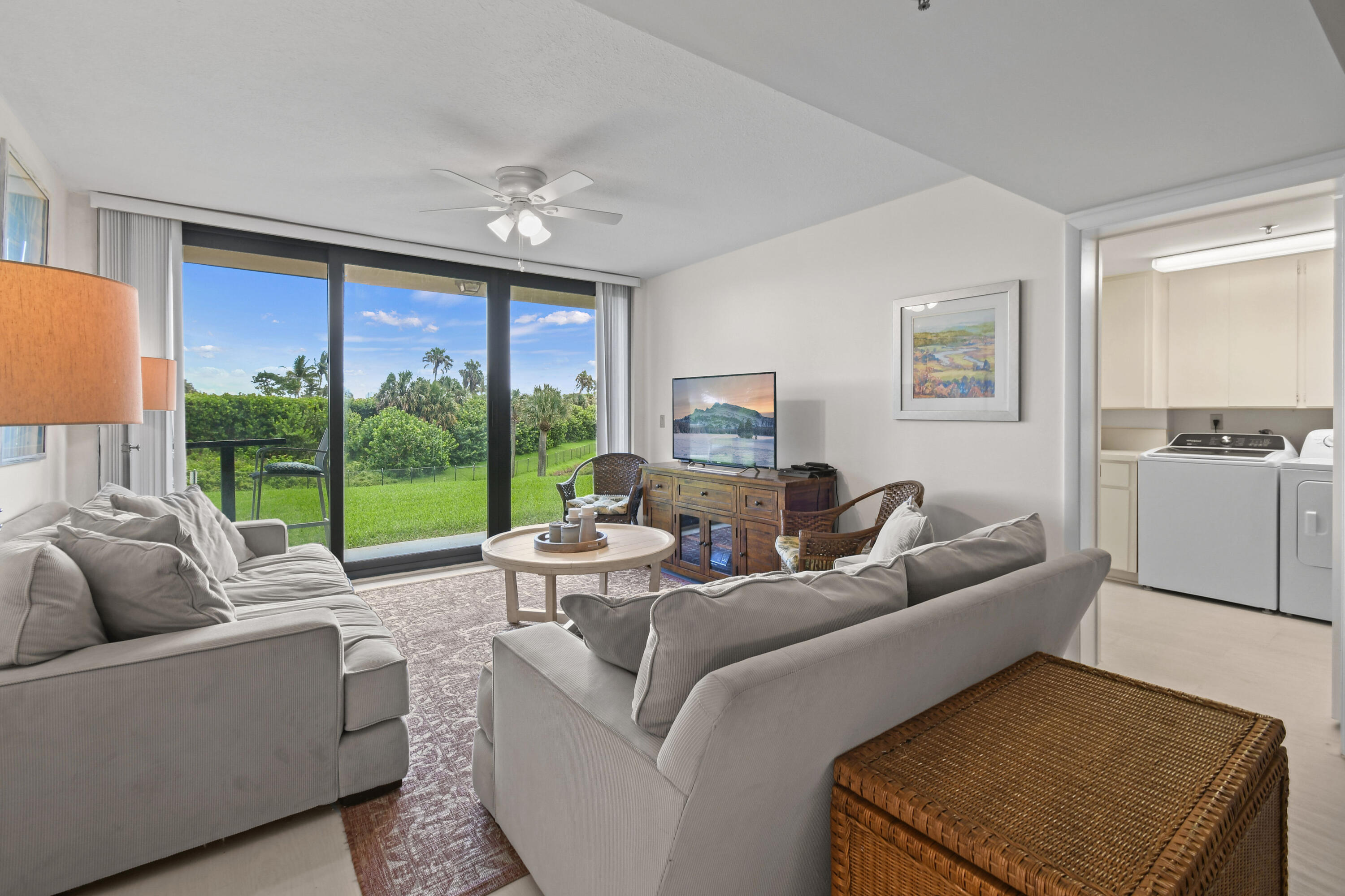 Undisclosed Address Jupiter, FL 33477 - Photo 6 of 23 a living room with furniture and a large window