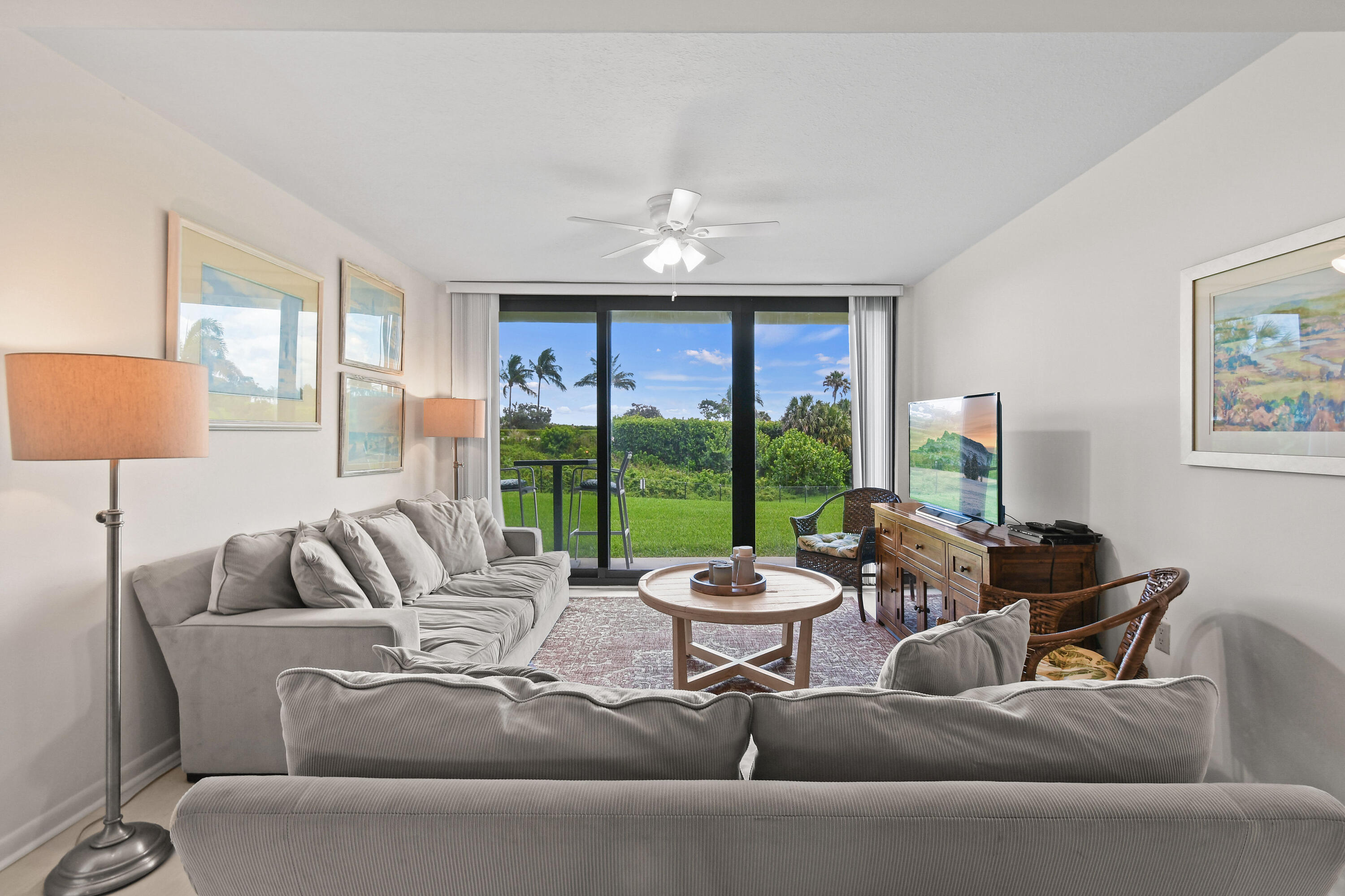 Undisclosed Address Jupiter, FL 33477 - Photo 7 of 23 a living room with furniture and a large window