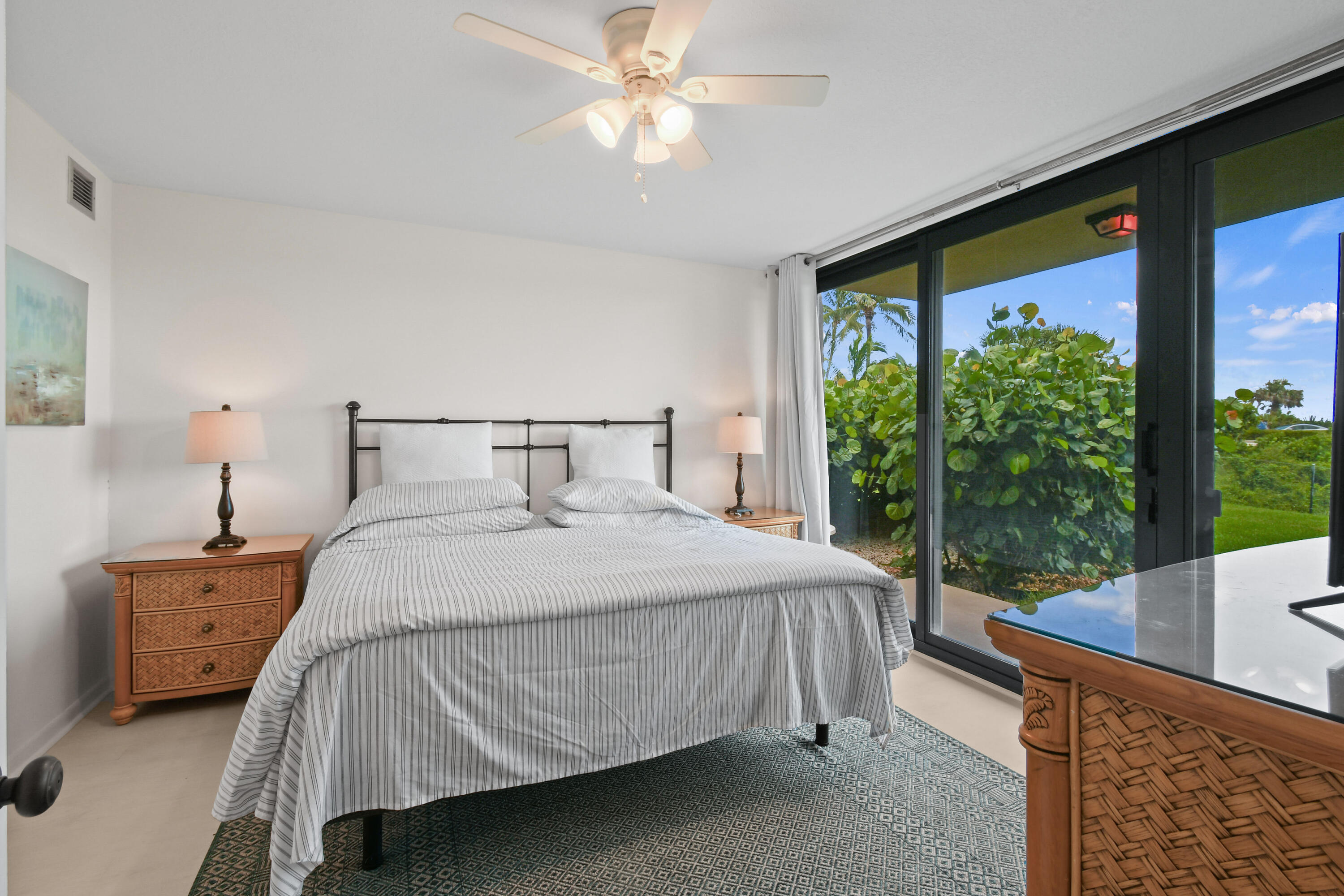 Undisclosed Address Jupiter, FL 33477 - Photo 9 of 23 a bedroom with a bed and a large window