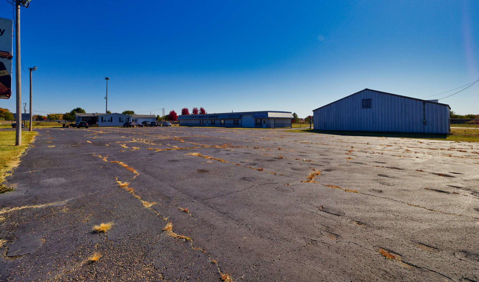 1592 North 30th Road, Unit 3 Ottawa, IL 61350 - Photo 20 of 22 a wooden bench sitting in middle of a field