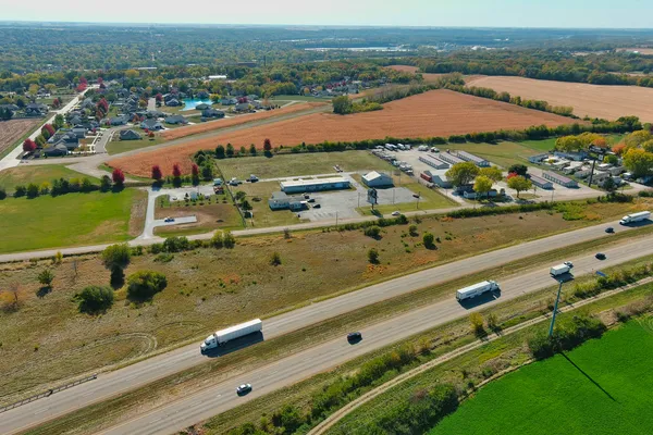 an aerial view of residential houses with outdoor space