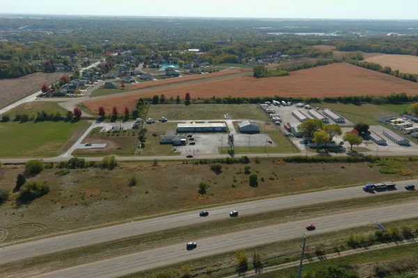 an aerial view of residential houses with outdoor space