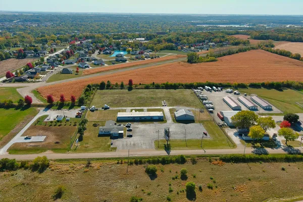 an aerial view of residential houses with outdoor space