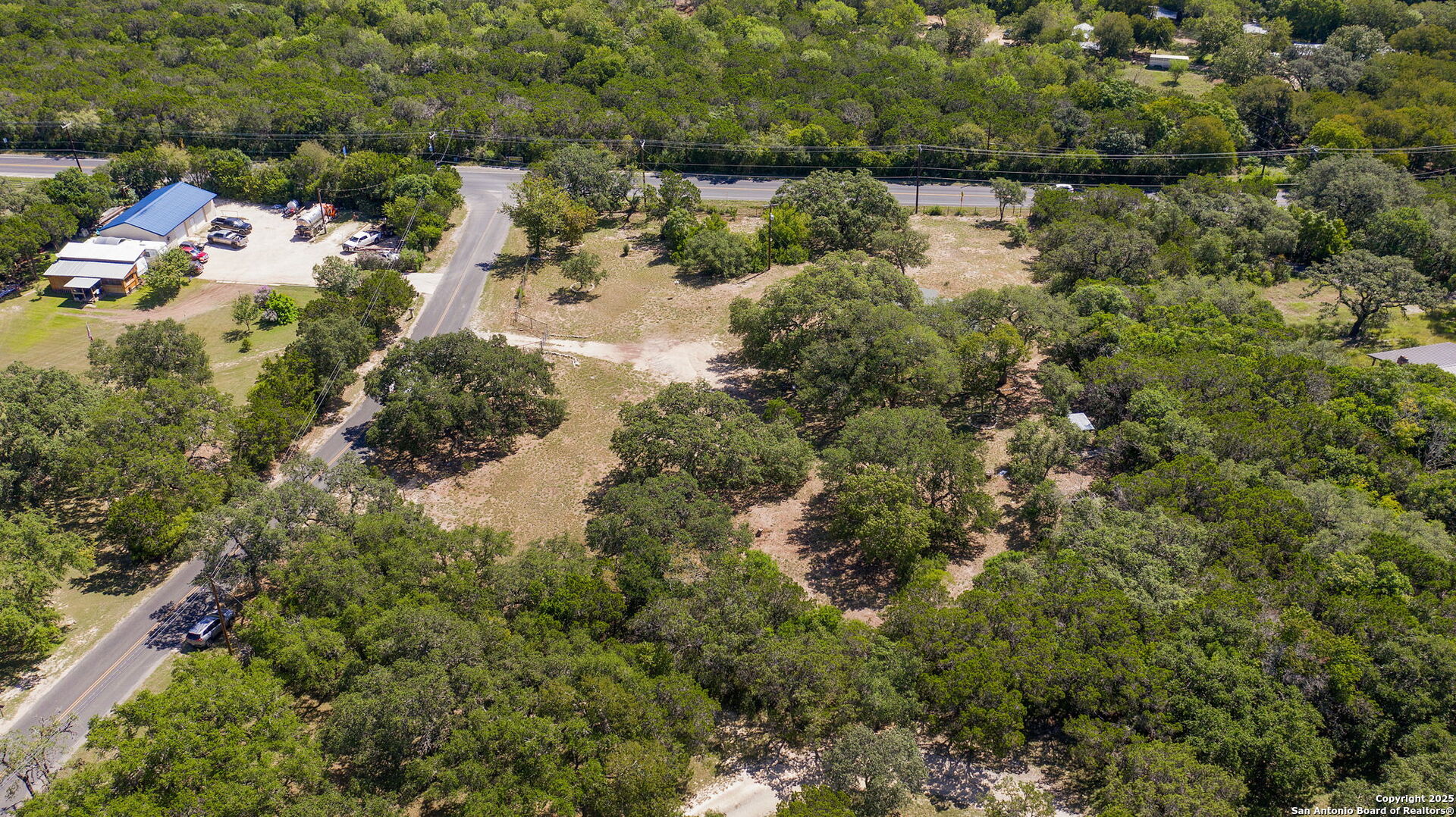 10096 Whip O Will Way Helotes, TX 78023 - Photo 12 of 39 a view of a lake with houses
