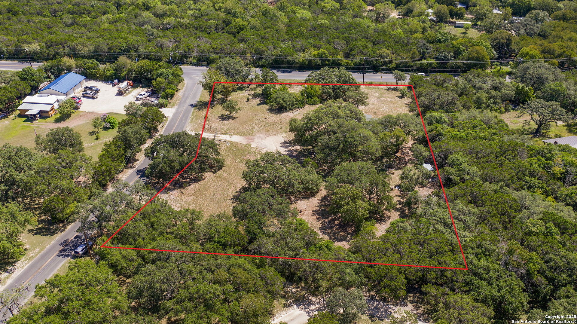 10096 Whip O Will Way Helotes, TX 78023 - Photo 13 of 39 an aerial view of residential house with outdoor space and trees around