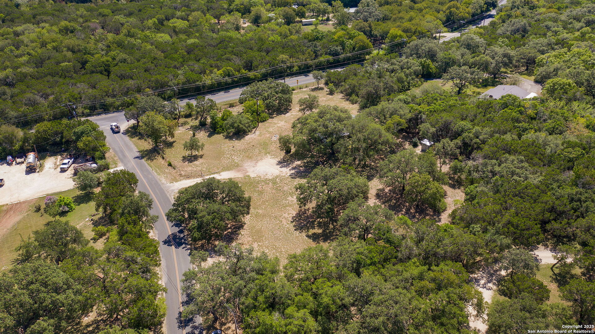 10096 Whip O Will Way Helotes, TX 78023 - Photo 14 of 39 an aerial view of residential house with outdoor space and trees all around