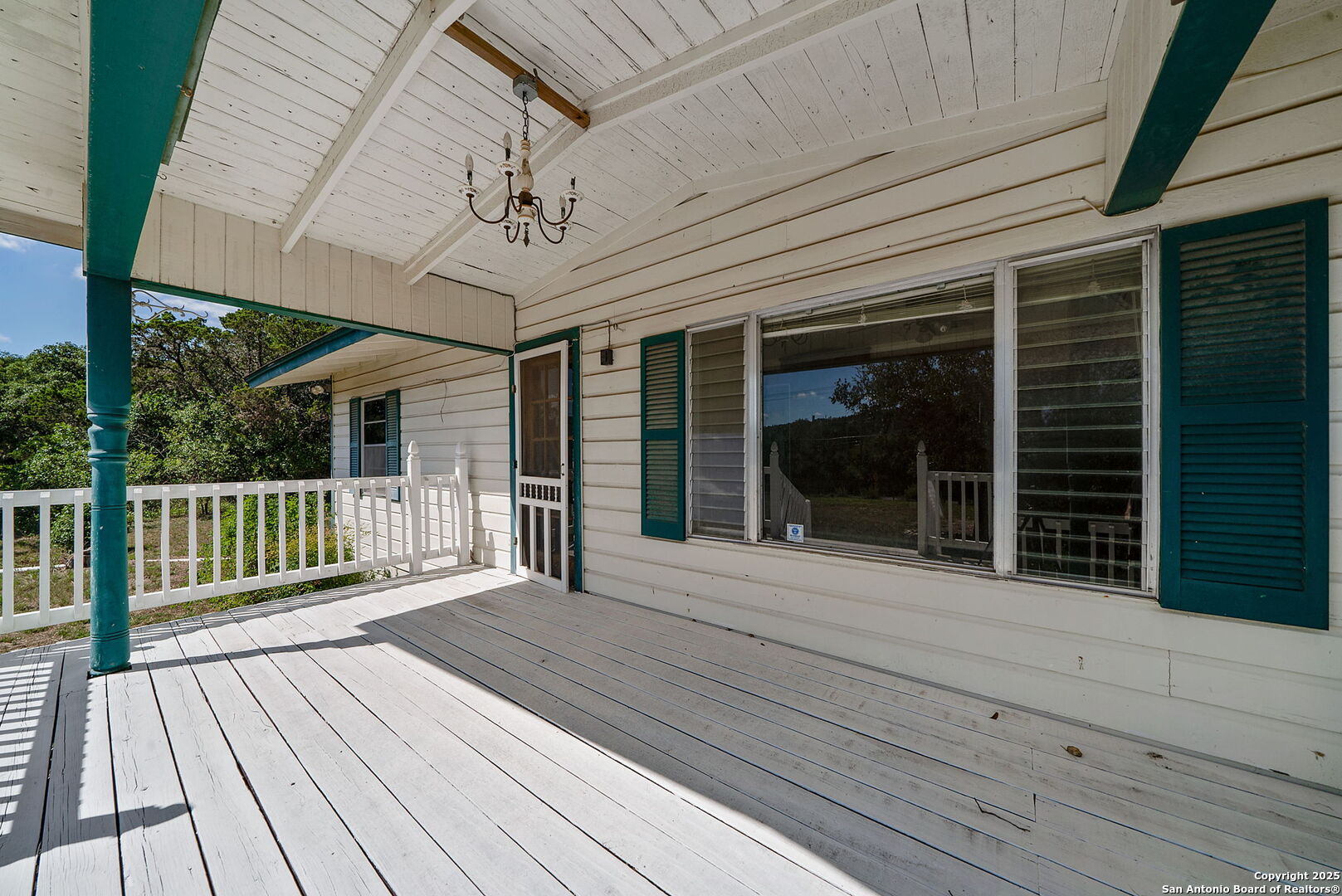 10096 Whip O Will Way Helotes, TX 78023 - Photo 19 of 39 a view of a house with wooden floor