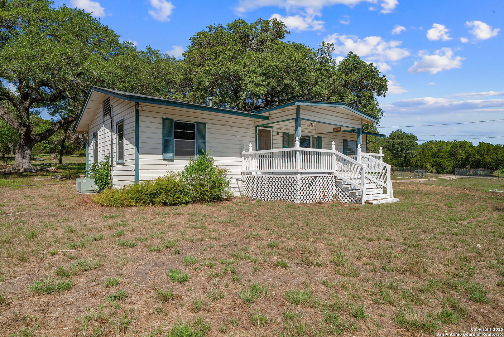 10096 Whip O Will Way Helotes, TX 78023 - Photo 20 of 39 a view of a house with a yard