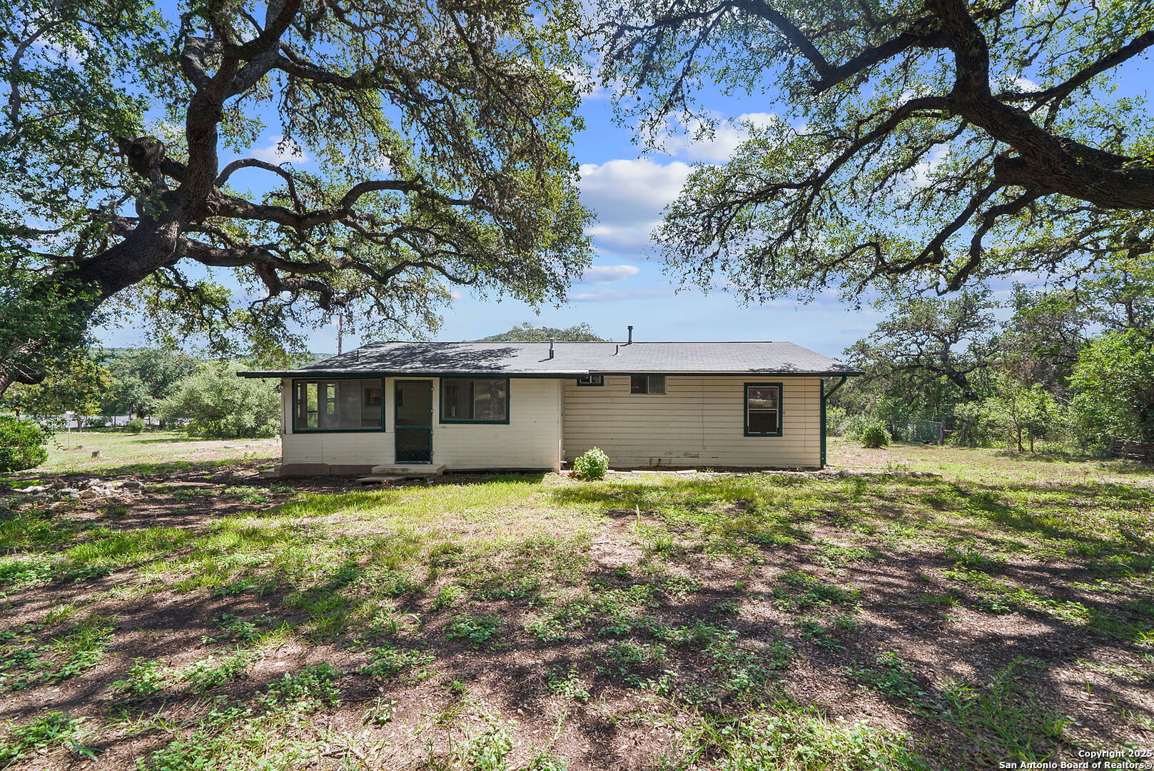 10096 Whip O Will Way Helotes, TX 78023 - Photo 25 of 39 a house that has a tree in front of it