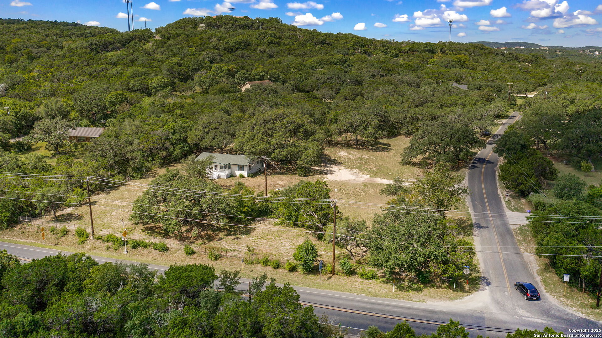 10096 Whip O Will Way Helotes, TX 78023 - Photo 7 of 39 a view of a yard with a tree