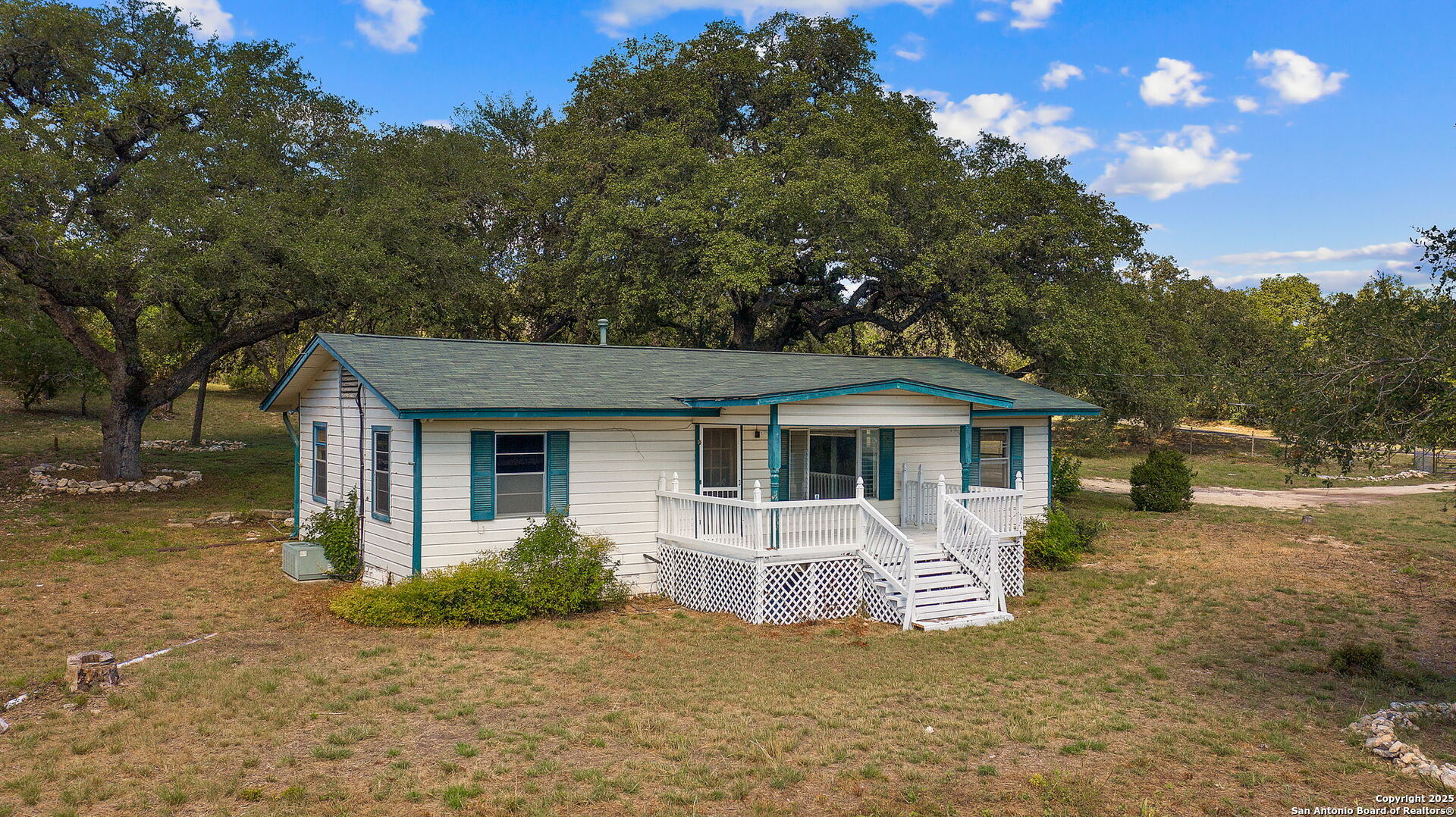 10096 Whip O Will Way Helotes, TX 78023 - Photo 8 of 39 a view of a house with a yard