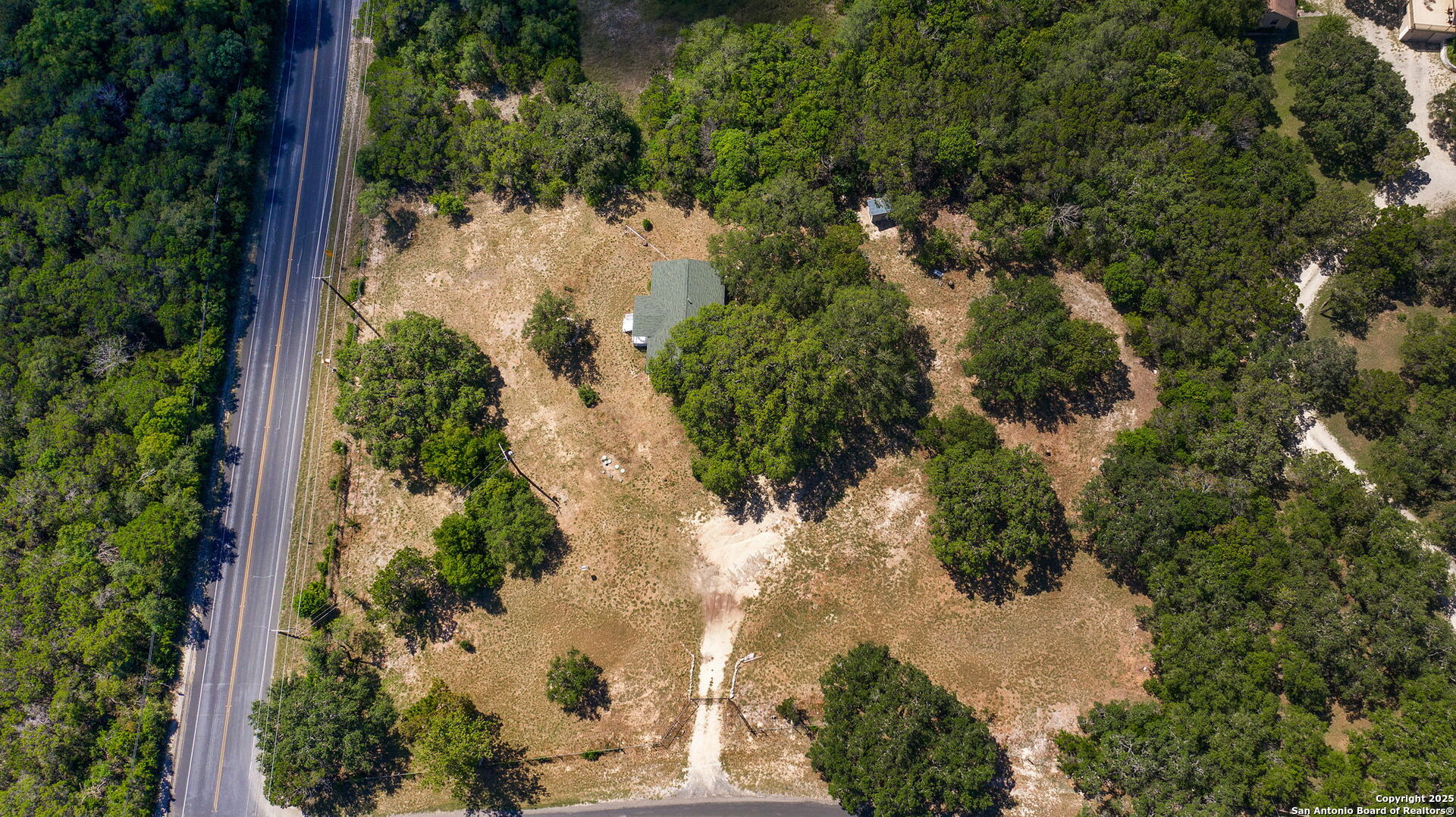 10096 Whip O Will Way Helotes, TX 78023 - Photo 9 of 39 an aerial view of a house with yard