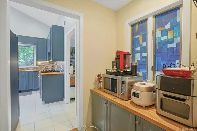 a kitchen with a refrigerator and a stove