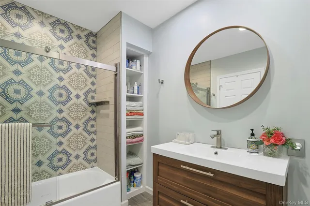 a bathroom with a sink and a mirror
