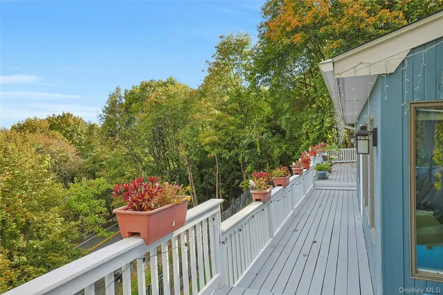 a balcony with wooden floor