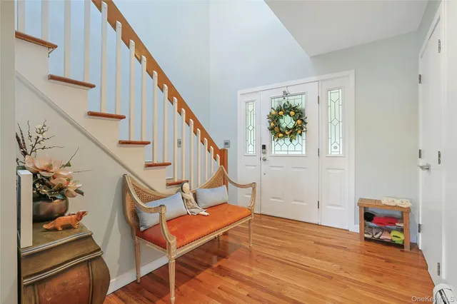 a view of entryway with wooden floor and stairs