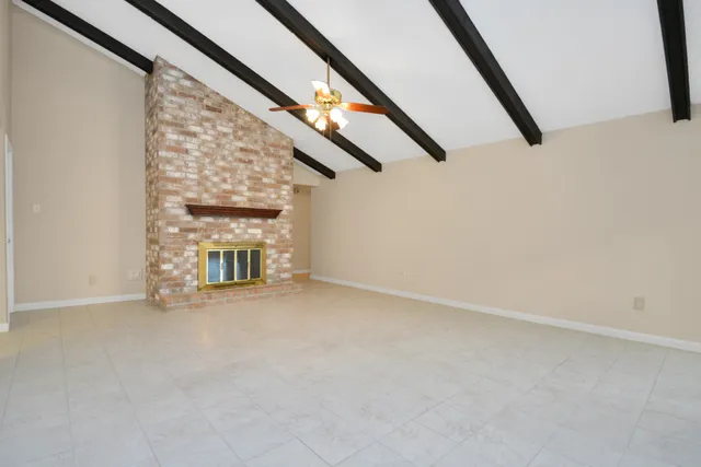 a view of an empty room with stairs