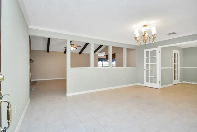 a view of a big room with windows and cabinet