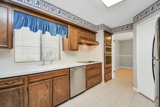 a kitchen with a sink and cabinets