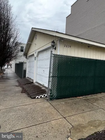 a front view of a house with garage