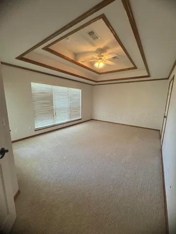 a view of empty room with fan